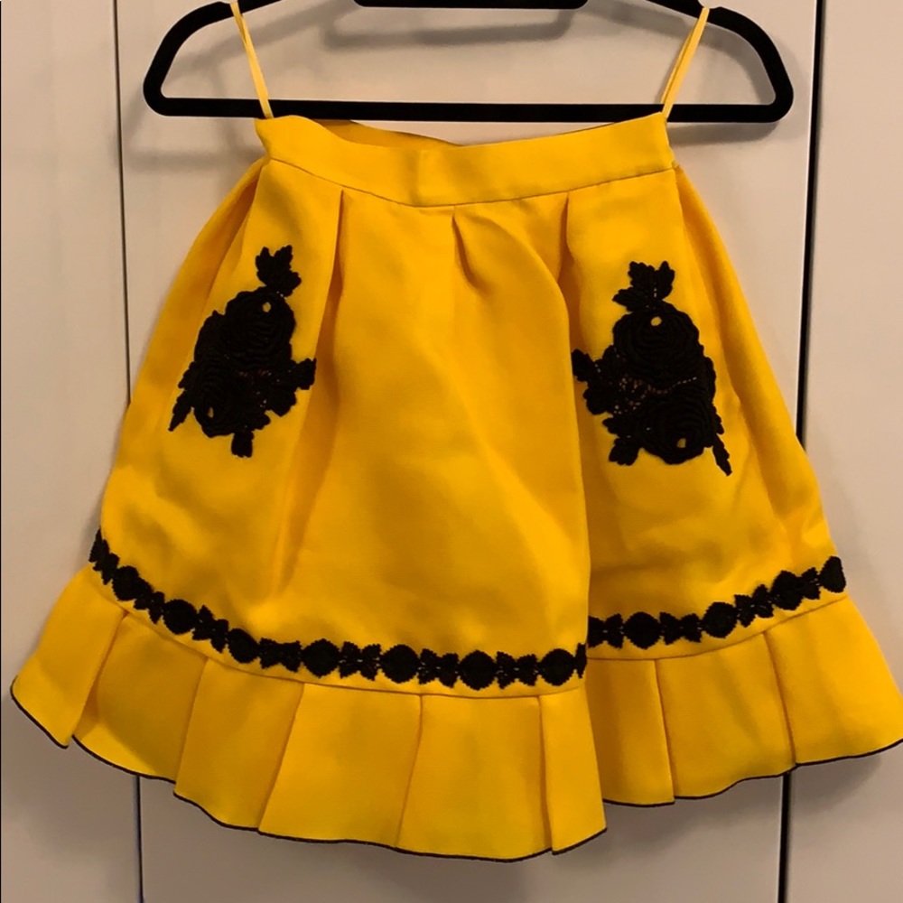 Cute yellow flared mini skirt.